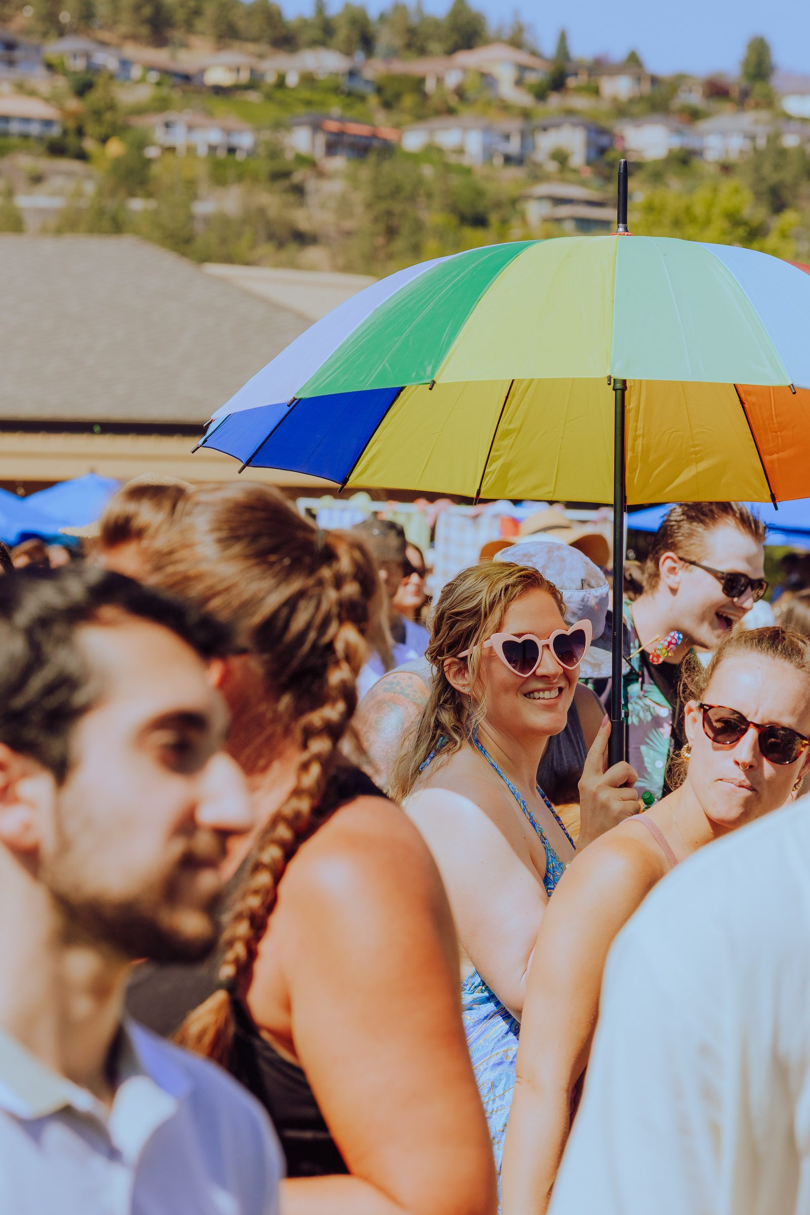 A couple dancing close in the daytime crowd